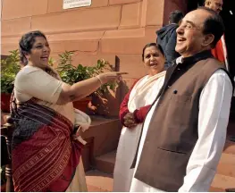  ??  ?? Congress leader Renuka Chowdary and BJP MP Subramania­n Swamyat at Parliament House during the winter session on Monday. —