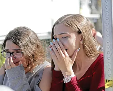  ?? PICTURE: AP ?? Students are released from a lockdown outside of Stoneman Douglas High School in Parkland, Florida, in the wake of the shooting in which 17 people were killed on Wednesday.
