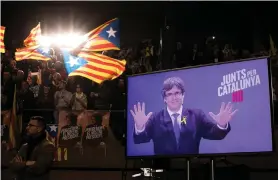  ?? AP ?? Ousted Catalan leader Carles Puigdemont appears on Tuesday in a video link from Brussels during a rally for his Junts Per Catalunya party. The latest polls are inconclusi­ve