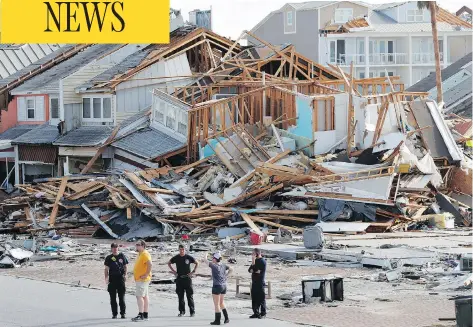  ?? GERALD HERBERT / THE ASSOCIATED PRESS ?? Rescue personnel perform a search operation in the aftermath of hurricane Michael in Mexico Beach, Fla., on Thursday.