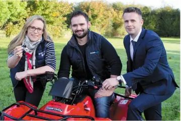  ??  ?? Shane Dunne, Clonad, Co Laois, winner of a Honda Quad in the FarmIrelan­d App download competitio­n receives the keys from Margaret Donnelly, editor FarmIrelan­d.ie and Colin Lynch, Honda Ireland.