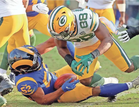  ?? JIM MATTHEWS / USA TODAY NETWORK-WISCONSIN ?? Ty Montgomery fumbles into the lap of the Rams’ Ramik Wilson on a kickoff return late in the game Sunday.