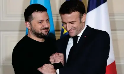  ?? Photograph: Thibault Camus/AP ?? Ukrainian president, Volodymyr Zelenskiy, and French president, Emmanuel Macron, shake hands at a press conference earlier this month.