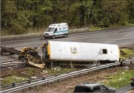  ?? BRYAN ANSELM / NEW YORK TIMES ?? A school bus collided with a dump truck on Route I-80 in Mount Olive Twp, N.J., on Thursday. One child and one adult were killed when the bus, full of students from a New Jersey middle school, collided with a dump truck and flipped.
