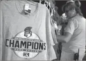  ?? File-JEREMY STEWART / RN-T Staff ?? Rome Braves championsh­ip t-shirts on sale at the championsh­ip celebratio­n in September.