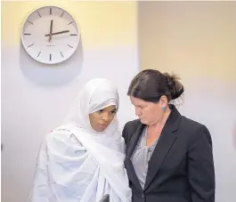  ?? EDDIE MOORE/JOURNAL ?? Hujrah Wahhaj talks with her attorney, Marie Legrand Miller, during a hearing that led to dismissal of child abuse charges against Wahhaj and others arrested after an Aug. 3 raid on a remote compound. Prosecutor­s say children at the compound were being trained to carry out armed attacks.