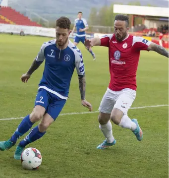  ??  ?? Former Sligo Rovers midfielder Lee Lynch tries to hold off Raffaele Cretaro. Cretaro netted Rovers’ opener during Saturday’s 3- 0 win over Limerick at the Showground­s. Pic: Donal Hackett.