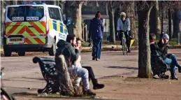  ??  ?? Patrol: Police in Hyde Park, London, where benches are in use