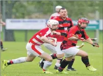  ??  ?? Photograph: Donald Cameron. Lochaber’s Zander Ferguson and Glenurquha­rt’s Neale Reid in action during their Premiershi­p match at the weekend which Lochaber won 3-2.