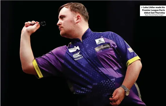  ?? Ryan Hiscott/Getty Images ?? > Luke Littler made his Premier League Darts debut last Thursday