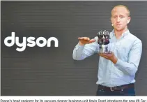  ?? Courtesy of Dyson ?? Dyson’s head engineer for its vacuum cleaner business unit Kevin Grant introduces the new V8 Carbon Fiber stick-type cordless cleaner during a press conference in Seoul, Tuesday.