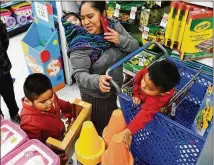  ?? KATHERINE FREY / WASHINGTON POST ?? Although experts are pushing the idea of toymakers selling products in grocery stores, other experts say parents would find the practice distractin­g during food shopping.