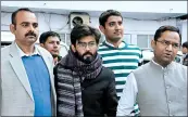  ?? DINESH JOSHI/AP ?? Police escort Sharjeel Imam, center, to court Jan. 29 in New Delhi. He has been charged as an enemy of India.