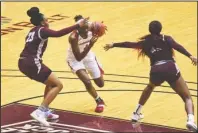  ?? Arkansas Democrat-Gazette/Staci Vandagriff ?? SLIPPING THROUGH: University of Arkansas’ Marquesha Davis (1) dribbles the ball between UALR’s Bre’Amber Scott (23) and Teal Battle (35) during Saturday’s game at the Jack Stephens Center in Little Rock.