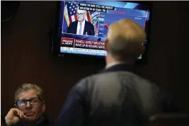  ?? SETH WENIG — THE ASSOCIATED PRESS FILE ?? Traders on the floor at the New York Stock Exchange watch Federal Reserve Chair Jerome Powell's news conference after the Federal Reserve interest rate announceme­nt on Feb. 1.