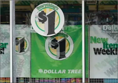  ?? (AP) ?? Dollar Tree promotes its $1 strategy in a storefront window in Jackson, Miss., in this file photo. The national chain will soon begin offering more items for higher prices.