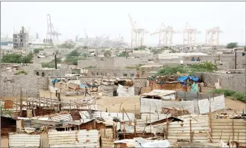  ?? — Reuters photo ?? File photo shows Hodeidah port’s cranes seen from a nearby shantytown in Hodeidah, Yemen.