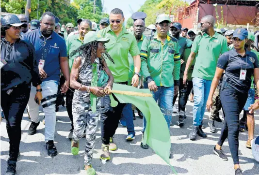  ?? GLADSTONE TAYLOR ?? Jamaica Labour Party party leader Andrew Holness and Candidates Mayor Delroy Williams Seivwright Gardens Division, Christophe­r Townsend Olympic Gardens Division and Glendon Salmon Molynes Gardens Division arrive with JLP supporters at the St Andrew West Central Nomination Centre located at the Waltham Park New Testament Church of God.