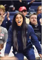  ?? Stephen Dunn / Associated Press ?? UConn’s Evina Westbrook cheers for her team from the bench during a game against California on Nov. 10, 2019, in Storrs.