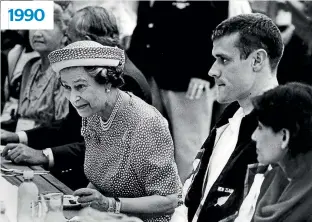  ?? PHOTO: STUFF ?? Queen Elizabeth lunches at the Commonweal­th Games Village during her 1990 royal tour of New Zealand. Days later, her visit to Waitangi ended with a T-shirt being thrown in her face.