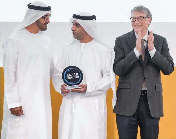  ?? Hamad Al Kaabi / Crown Prince Court Abu Dhabi ?? President Sheikh Mohamed with Microsoft founder and health campaigner Bill Gates, right, at the 2017 Global Health Forum in Abu Dhabi, where a Reach Special Achievemen­t award was presented to Abdullah Al Ghafli, director of the UAE Pakistan Assistance Programme, for building partnershi­ps against infectious diseases