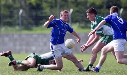  ??  ?? Eamonn Breen of St Patrick’s collects following Robbie Leavy of St Mary’s slip in Pairc Mhuire, Ardee.