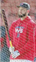  ?? STAFF PHOTO BY STUART CAHILL ?? WAITING TO GET HIS HACKS IN: Red Sox reserve player Blake Swihart waits outside the batting cage for his turn during yesterday’s workout at Fenway Park.