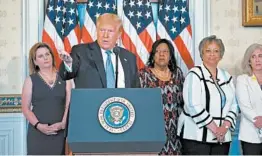  ?? ANNA MONEYMAKER/THE NEW YORK TIMES ?? President Donald Trump marks the centennial of the ratificati­on of the 19th Amendment, which granted women the right to vote, at a ceremony Tuesday in the White House.