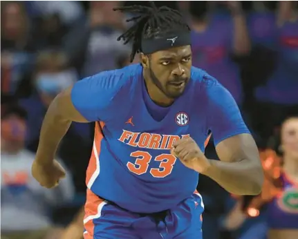  ?? MATT STAMEY/AP ?? Florida center Jason Jitoboh runs up court after making a shot against Alabama on Jan. 5, 2022, in Gainesvill­e. Jitoboh took a finger to his left eye at Tennessee last January and spent the better part of a year trying to get right. He’s had four surgeries already and might have a fifth following the season. He faces the second-ranked Volunteers for the first time since his injury when Florida hosts Tennessee on Wednesday.