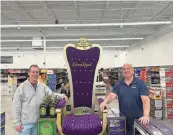  ?? ?? Co-owners and brothers Michael Byer, left, and Andrew Byer, stand in front of a Crown Royal display at their Claymont store, Tri-State Liquors. For months, Tri-State Liquors had been the sole tenant in Claymont’s once-bustling Tri-State Mall property.