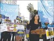  ?? Rich Pedroncell­i Associated Press ?? LAWMAKERS this year sought to limit businesses’ use of independen­t contractor­s with AB 5. Above, Assemblywo­man Lorena Gonzalez at an August rally.