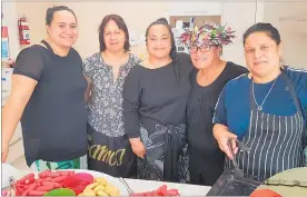  ??  ?? Ladies from Wha¯ nau Manaaki Kindergart­ens cooking up a feast at the reopening celebratio­ns.