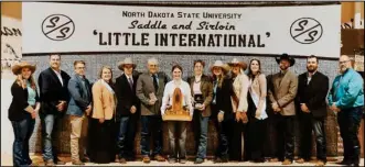  ?? (NDSU photo) ?? Rose Wendel (pictured center), a freshman in liberal arts from Lamoure, North Dakota, was named the overall showman at the 97th Little Internatio­nal at North Dakota State University.