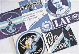  ??  ?? Kick it out: Anti-fascist and anti-racist stickers printed by the Laziale and Antifascis­t group to fight the stereotype about the club’s supporters.
Photo: Andreas Solaro/afp