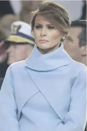  ?? MARK WILSON/GETTY IMAGES ?? In a dress that seems to echo Kennedy, Melania Trump attends her husband’s inaugurati­on.