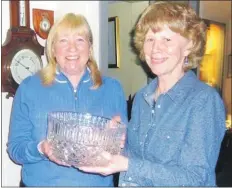  ??  ?? Captain Mary Adams, right, presents the Josie Sanderson bowl to winner Ann May at Lamlash Golf Club.