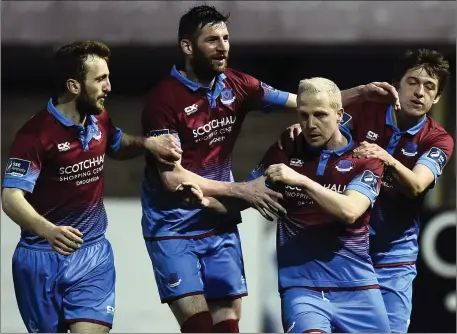  ?? Photo: David Maher/Sportsfile ?? Sean Thornton, then of Drogheda United, is congratula­ted by teammates Colm Deasy, Gavin Brennan and Jake Hyland after scoring in one of the last League of Ireland games of his career against Shamrock Rovers a year ago.