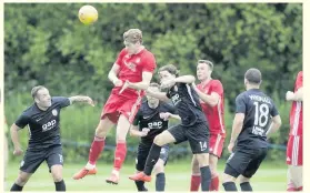  ??  ?? HIGH RISER returning Dons star Taylor comes close with a header