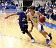  ?? Photo courtesy of JBU Sports Informatio­n ?? John Brown University senior Zach English, right, drives by Oklahoma City’s Lou Dunbar in the second half of Thursday’s game at Bill George Arena. English scored 21 points, but Dunbar had 27 and Oklahoma City defeated JBU 84-76.