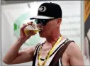  ?? AP PHOTO/FU TING ?? In this May 17 photo a man drinks beer at the 2018 Craft Beer of China Exhibition in Shanghai.
