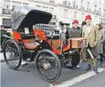  ??  ?? Colin Clarke and mechanic Tony Smallbone say that this 1898 Peugeot Type 15 is one of only two cars at the show that need to be started by lighting a match and a naked flame! This unique machine also has cruise control and will slow itself down if going too fast down a hill.