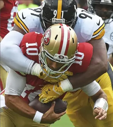  ?? Peter Diana/Post-Gazette ?? Steelers defensive end Stephon Tuitt sacks San Francisco 49ers quarterbac­k Jimmy Garoppolo. Tuitt now has 3.5 sacks in three games this season.