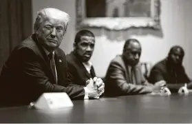  ?? Doug Mills / New York Times ?? President Donald Trump meets with African American supporters in the White House. Trump rejected new names for bases that honor Confederat­e leaders.