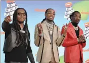  ?? PHOTO BY RICHARD SHOTWELL — INVISION — AP, FILE ?? Takeoff, from left, Quavo and Offset, of Migos, appear at the Nickelodeo­n Kids’ Choice Awards in Los Angeles on March 23, 2019.