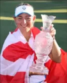  ?? Gregory Shamus/Getty Images ?? Emily Kristine Pedersen of Team Europe celebrates with the Solheim Cup after winning over Team USA Monday at the Inverness Club in Toledo, Ohio.