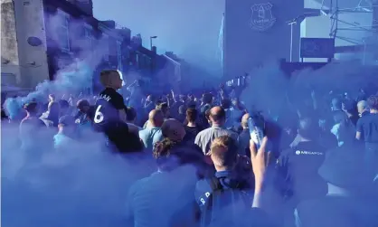  ?? Gareth Copley/Getty Images ?? Everton fans at Goodison Park on Thursday. Rival clubs want an investigat­ion that could lead to a fine or even docked points. Photograph: