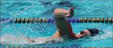  ?? MIKE BUSH/NEWS-SENTINEL ?? Lodi's Madeline Woznick took first place in the varsity girls 100 freestyle at Saturday's TCAL championsh­ips at Tokay's swimming pool.