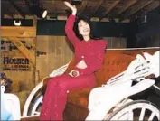  ?? Arlene Richie Getty Images ?? SELENA waves to the crowd at the Houston Livestock Show & Rodeo in 1995. It was her final show.