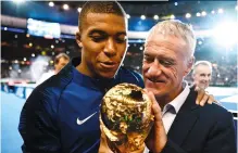  ??  ?? Below Caressing the World Cup again, now as coach, in 2018
Bottom Can he repeat this feat at Euro 2020?