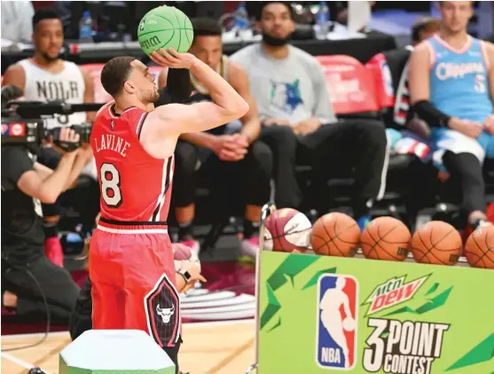  ?? JASON MILLER/GETTY IMAGES ?? With only 14 points, Zach LaVine had the lowest total of the night and was eliminated in the first round of the three-point contest Saturday.